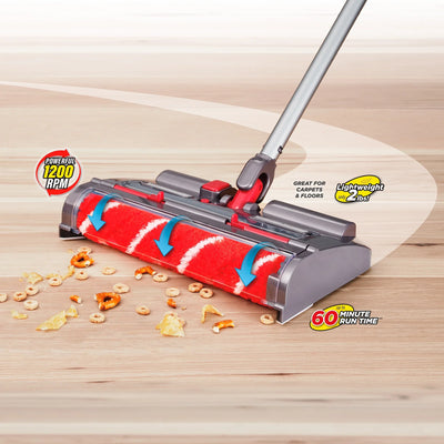 Vacuum cleaner head cleaning up cereal spills on a wooden floor with feature labels.
